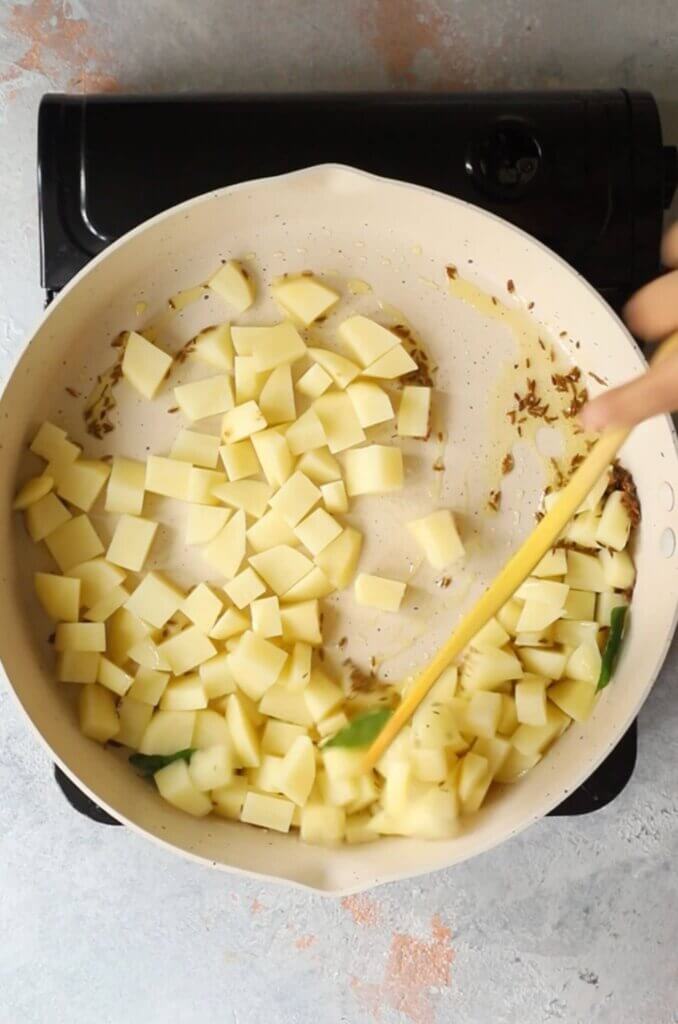 Add potatoes to the sabudana khichdi