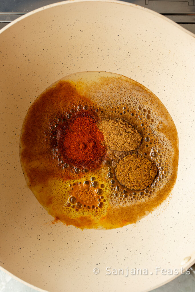 Add ground spices to the oil