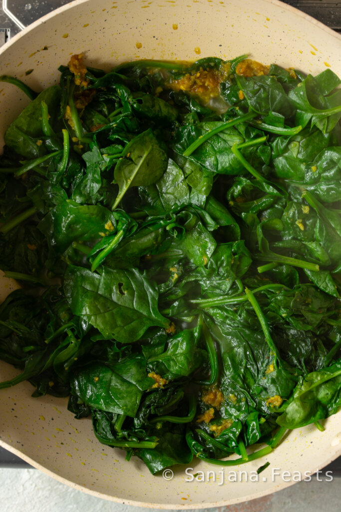 Wilted spinach for palak mushroom saag