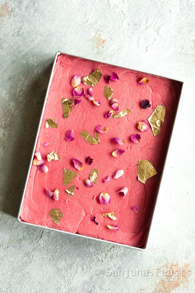 Strawberry Barfi Recipe (2 Ingredients) ice cream tub strawberry barfi decorated with rose petals