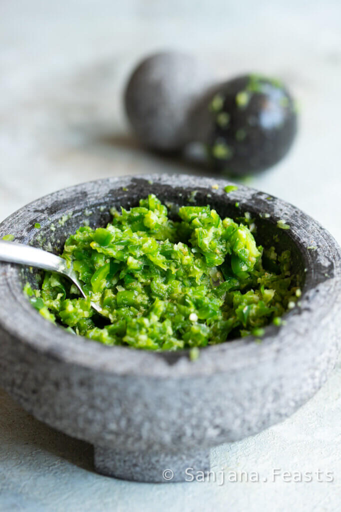 make a coarse spice paste with garlic ginger and green pepper