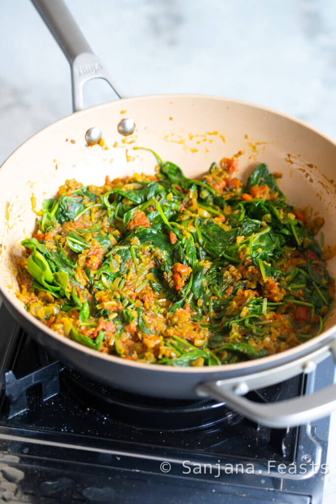 First, wilt the spinach